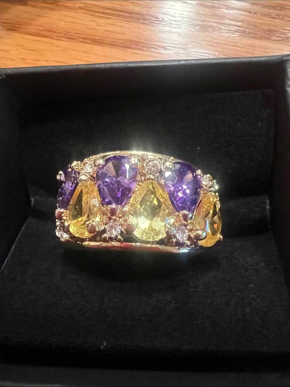 New 1990s Camille Lucie deadstock gold in color with purple and yellow stones
